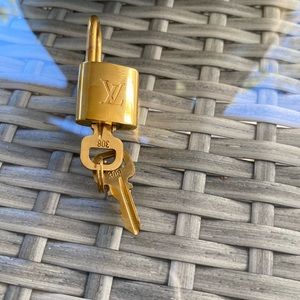 Louis Vuitton lock and keys. # 308 in polished brass.